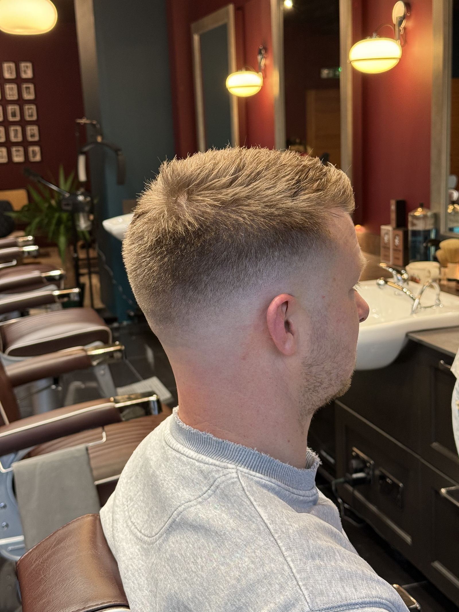 Barber detailing a client's haircut
